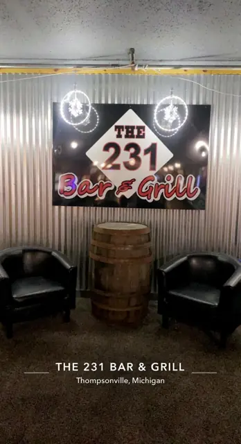 The 231 sign and whiskey barrel
